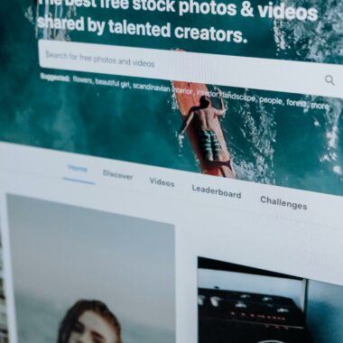 Close-up of a computer screen showing a stock photo website interface with multiple images.
